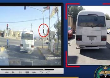ضبط باص نقل عمومي تجاوز الإشارة الحمراء في إربد